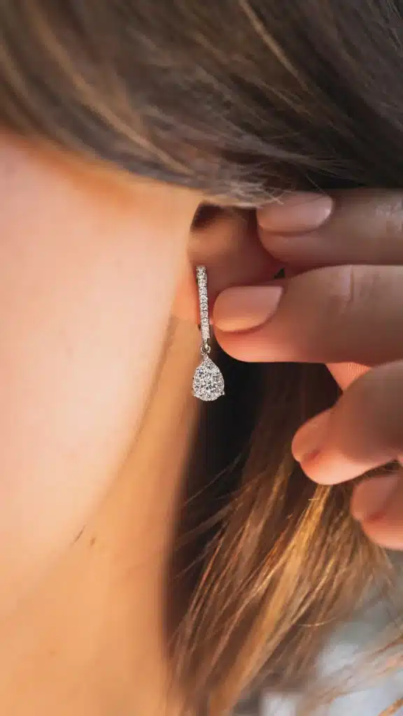 Pear drop diamond huggies white gold