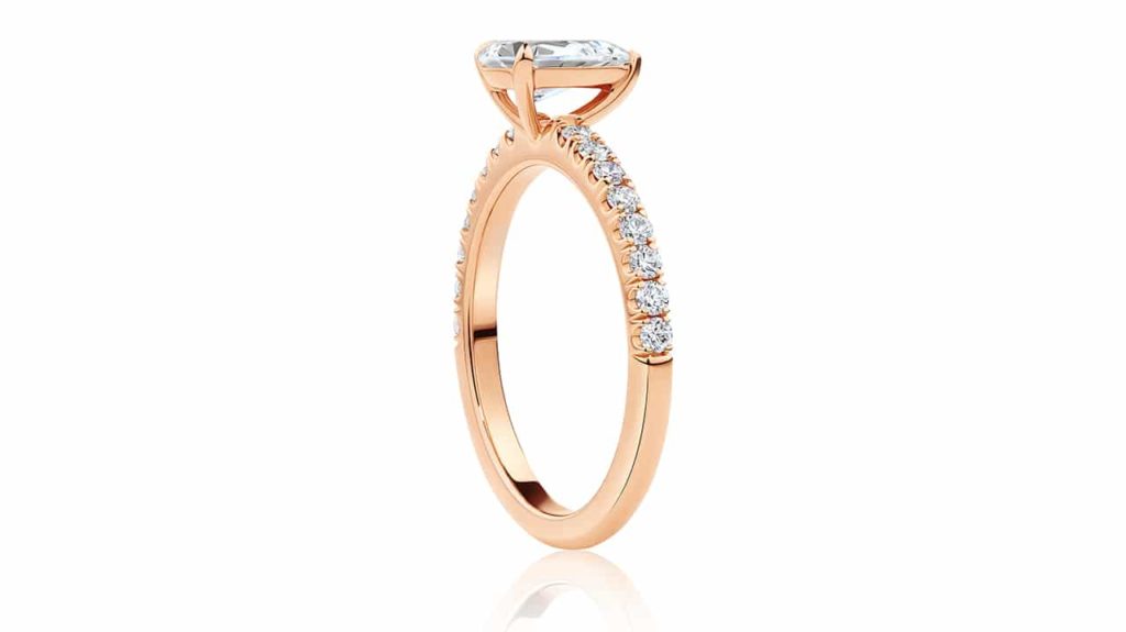 Dianella 0.70 carat pear cut diamond with diamond band profile view