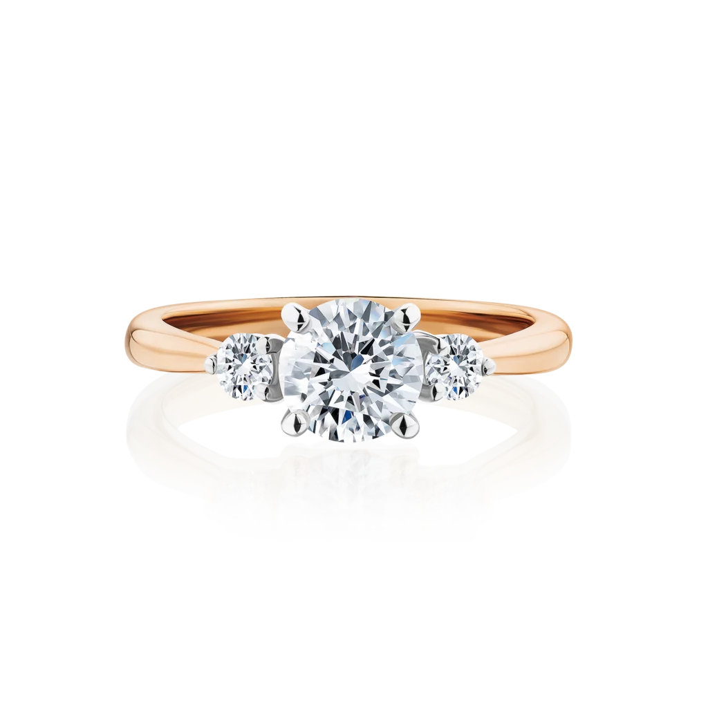 Frangipani-round-cut-rose-gold-two-tone-trilogy-diamond-engagement-ring