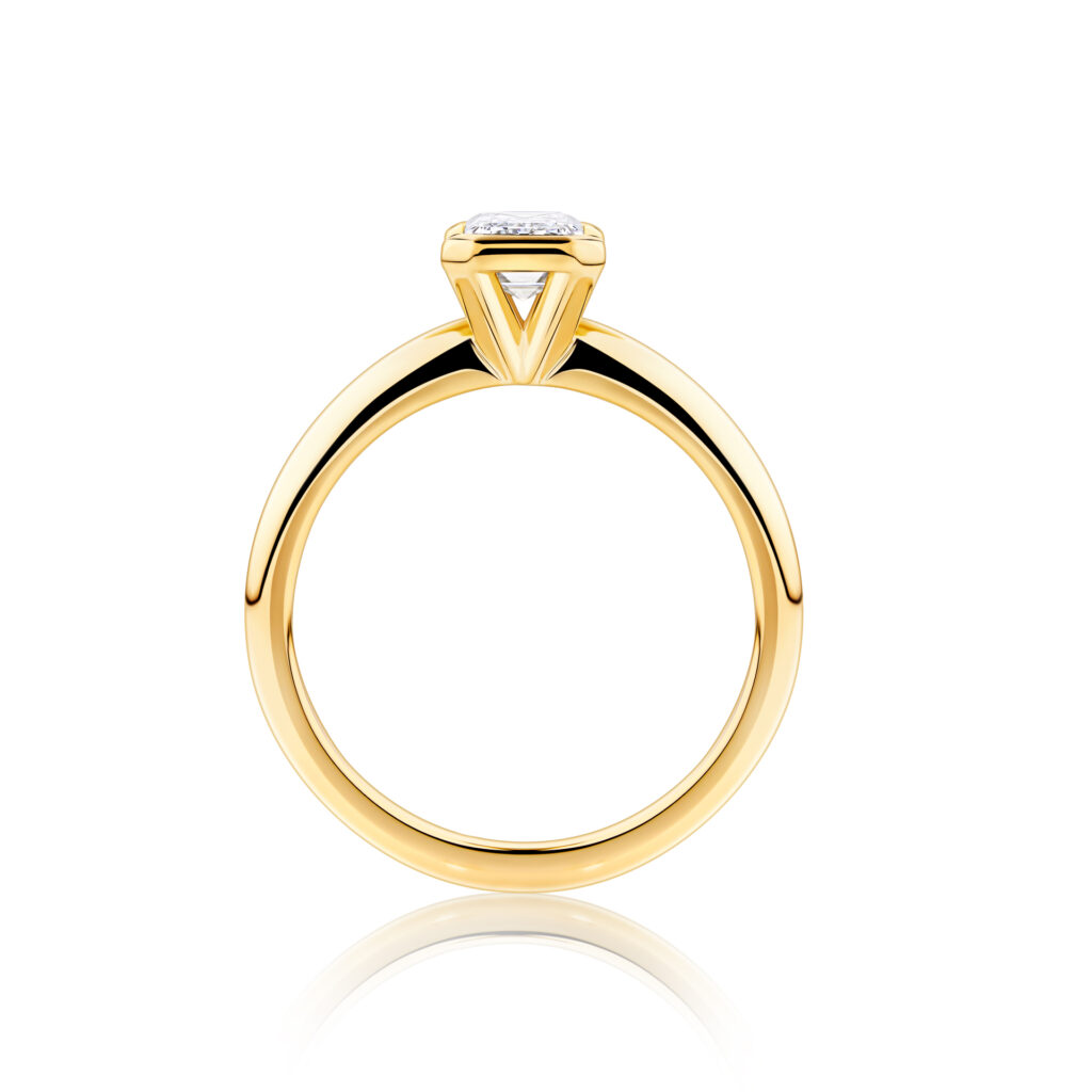 Alyxia emerald bezel yellow gold diamond ring side view